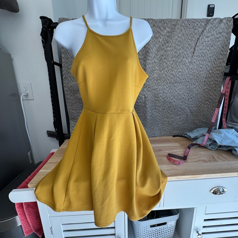Mustard yellow fit and flair halter style dress.M